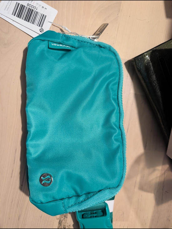 lululemon athletica Handbags - lululemon teal zip pouch with silver hardware
